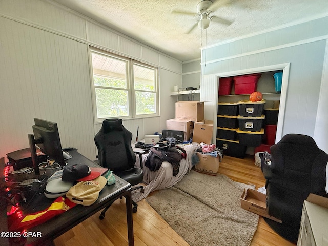 5382 10th St, Malone, FL 32445 - home office featuring wood finished floors, a ceiling fan, a textured ceiling, and crown molding