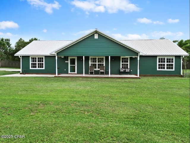 21382 NW Paradise Ln, Altha, FL 32421 - view of front of property with a front lawn and metal roof