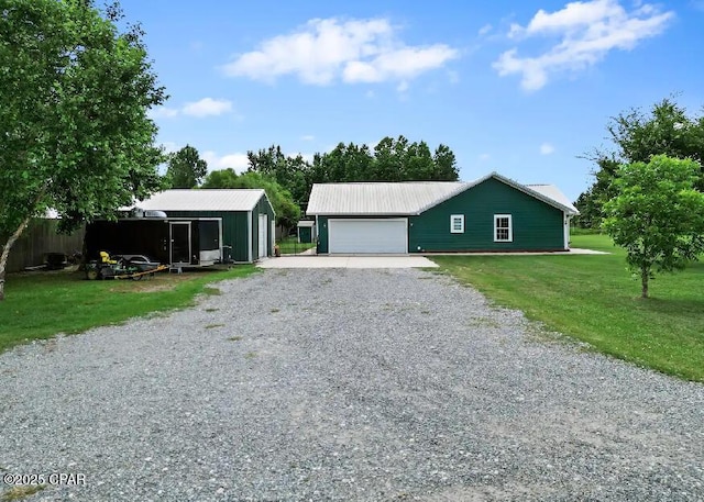 21382 NW Paradise Ln, Altha, FL 32421 - garage featuring gravel driveway