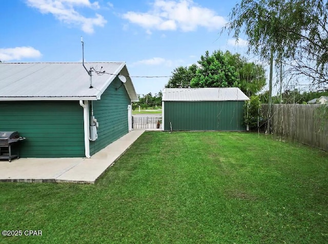21382 NW Paradise Ln, Altha, FL 32421 - view of yard featuring an outbuilding and a patio