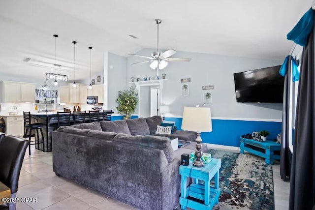 21382 NW Paradise Ln, Altha, FL 32421 - living room with a ceiling fan, high vaulted ceiling, and light tile patterned floors