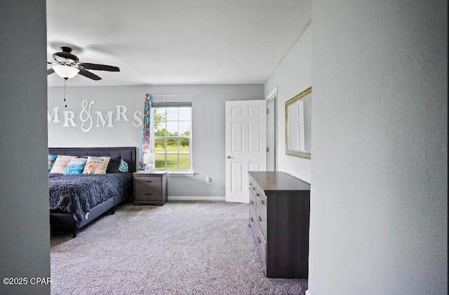 21382 NW Paradise Ln, Altha, FL 32421 - carpeted bedroom with baseboards and a ceiling fan