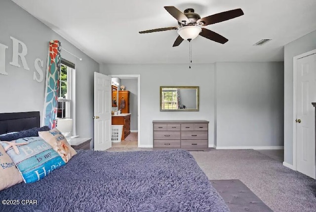 21382 NW Paradise Ln, Altha, FL 32421 - bedroom featuring carpet flooring, a ceiling fan, baseboards, and connected bathroom