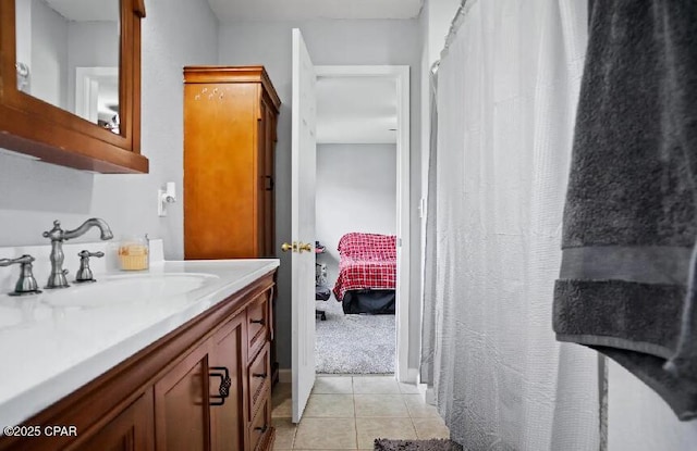 21382 NW Paradise Ln, Altha, FL 32421 - full bath featuring vanity, tile patterned floors, connected bathroom, and a shower with shower curtain