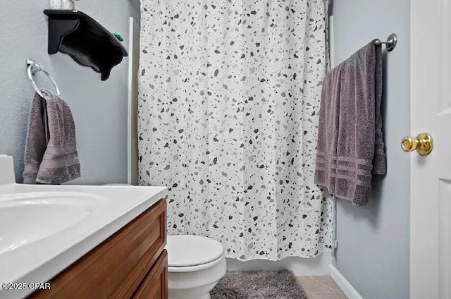 21382 NW Paradise Ln, Altha, FL 32421 - full bathroom with vanity, tile patterned flooring, toilet, a shower with curtain, and baseboards