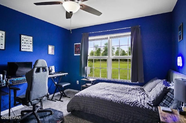 21382 NW Paradise Ln, Altha, FL 32421 - bedroom featuring a desk, a ceiling fan, baseboards, and carpet flooring