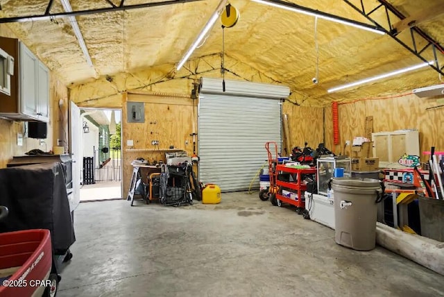 21382 NW Paradise Ln, Altha, FL 32421 - garage with a workshop area and electric panel