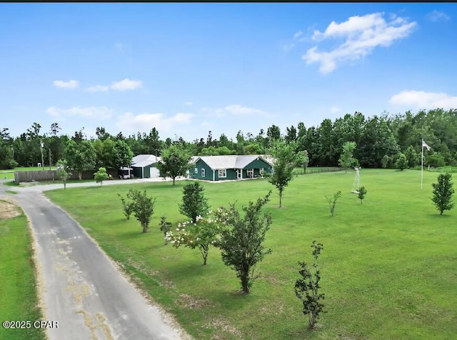 21382 NW Paradise Ln, Altha, FL 32421 - view of home's community featuring a lawn and view of wooded area
