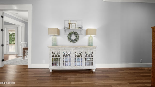 24197 NW Pine Tree Trl, Fountain, FL 32438 - hallway featuring ornamental molding, wood finished floors, and decorative columns