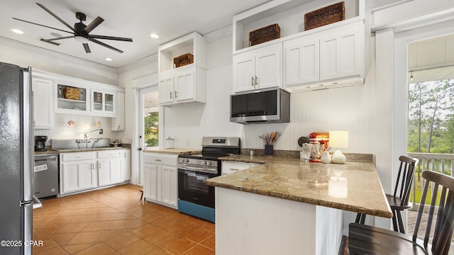24197 NW Pine Tree Trl, Fountain, FL 32438 - kitchen featuring appliances with stainless steel finishes, a peninsula, open shelves, ceiling fan, and white cabinets