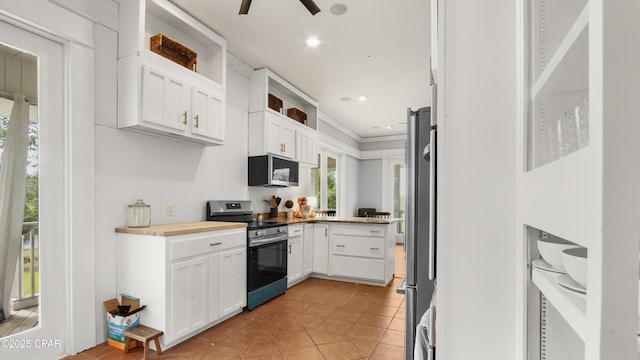 24197 NW Pine Tree Trl, Fountain, FL 32438 - kitchen with appliances with stainless steel finishes, white cabinetry, open shelves, light tile patterned floors, and light countertops