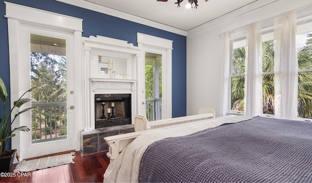 24197 NW Pine Tree Trl, Fountain, FL 32438 - bedroom featuring a fireplace, hardwood / wood-style floors, multiple windows, and ornamental molding