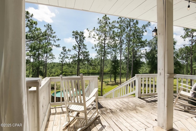 24197 NW Pine Tree Trl, Fountain, FL 32438 - deck featuring view of wooded area