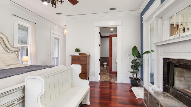 24197 NW Pine Tree Trl, Fountain, FL 32438 - bedroom with wood finished floors, ornamental molding, and a fireplace