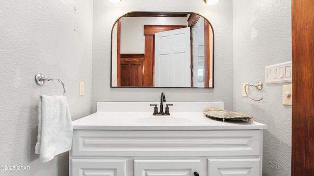 24197 NW Pine Tree Trl, Fountain, FL 32438 - bathroom featuring vanity and a textured wall