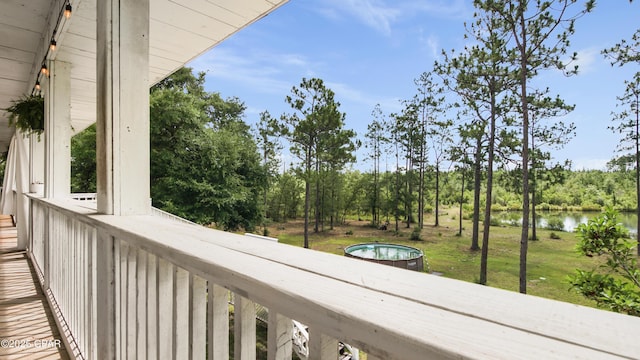 24197 NW Pine Tree Trl, Fountain, FL 32438 - balcony with a water view and view of wooded area