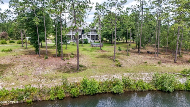 24197 NW Pine Tree Trl, Fountain, FL 32438 - view of green lawn featuring a water view