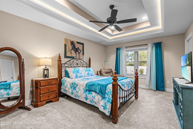 4304 Bylsma Cir, Panama City, FL 32404 - bedroom featuring light colored carpet, a tray ceiling, baseboards, and a ceiling fan