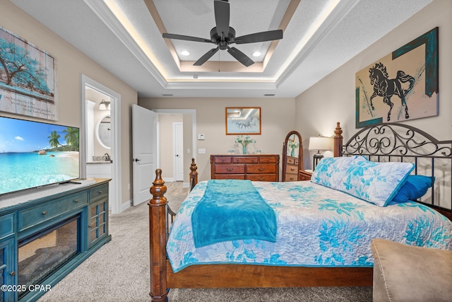 4304 Bylsma Cir, Panama City, FL 32404 - carpeted bedroom with recessed lighting, a tray ceiling, a ceiling fan, baseboards, and connected bathroom