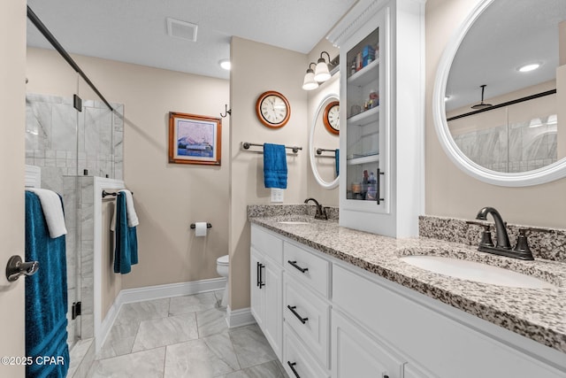 4304 Bylsma Cir, Panama City, FL 32404 - full bath featuring double vanity, a shower stall, marble finish floors, and baseboards