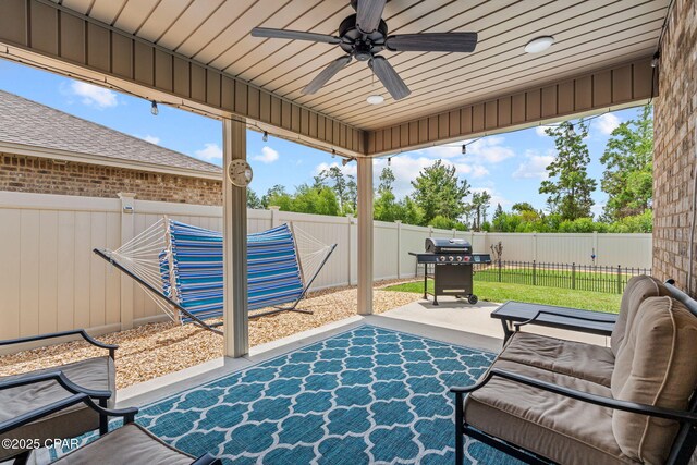 4304 Bylsma Cir, Panama City, FL 32404 - fenced backyard featuring a patio, a ceiling fan, and grilling area