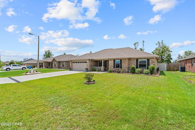 4304 Bylsma Cir, Panama City, FL 32404 - view of front of home featuring driveway, an attached garage, central AC, brick siding, and a shingled roof