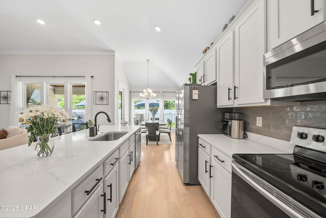 2012 Frankford Point Rd, Panama City, FL 32405 - kitchen featuring stainless steel appliances, a sink, a chandelier, plenty of natural light, and recessed lighting