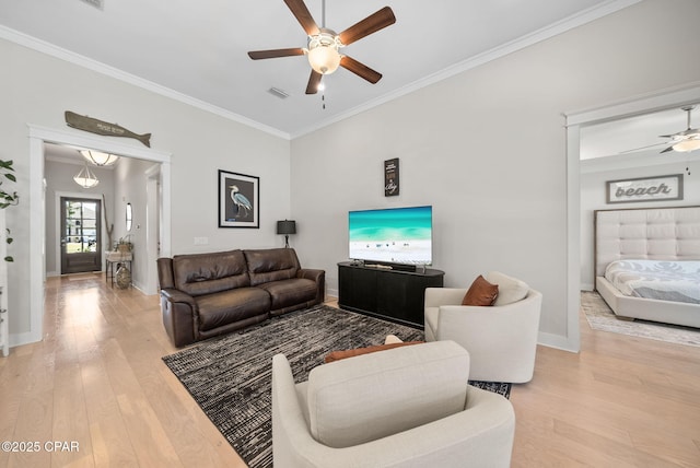 2012 Frankford Point Rd, Panama City, FL 32405 - living room featuring a ceiling fan, light wood-style flooring, ornamental molding, and baseboards