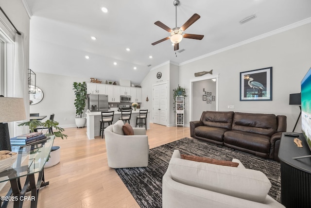 2012 Frankford Point Rd, Panama City, FL 32405 - living room featuring ceiling fan, light wood-type flooring, recessed lighting, vaulted ceiling, and ornamental molding