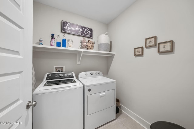 2012 Frankford Point Rd, Panama City, FL 32405 - laundry room with washer and clothes dryer, baseboards, and light tile patterned floors