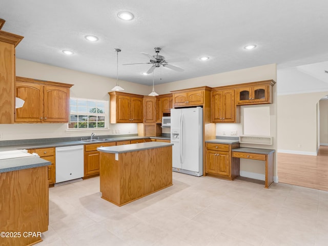 1406 New Jersey Ave, Lynn Haven, FL 32444 - kitchen with white appliances, a ceiling fan, arched walkways, a kitchen island, and recessed lighting
