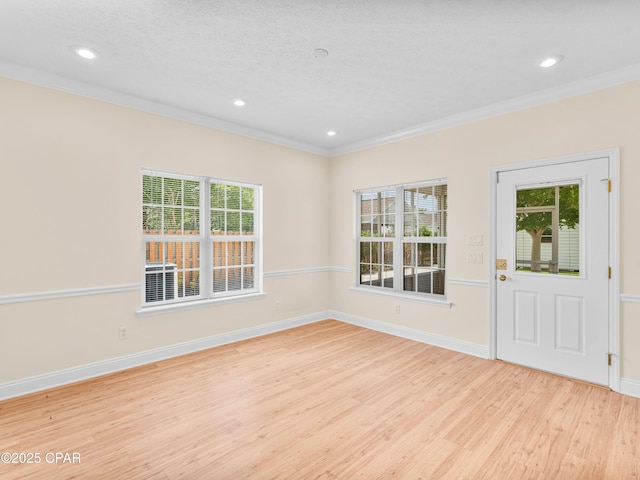 1406 New Jersey Ave, Lynn Haven, FL 32444 - entryway featuring wood finished floors, ornamental molding, plenty of natural light, recessed lighting, and baseboards