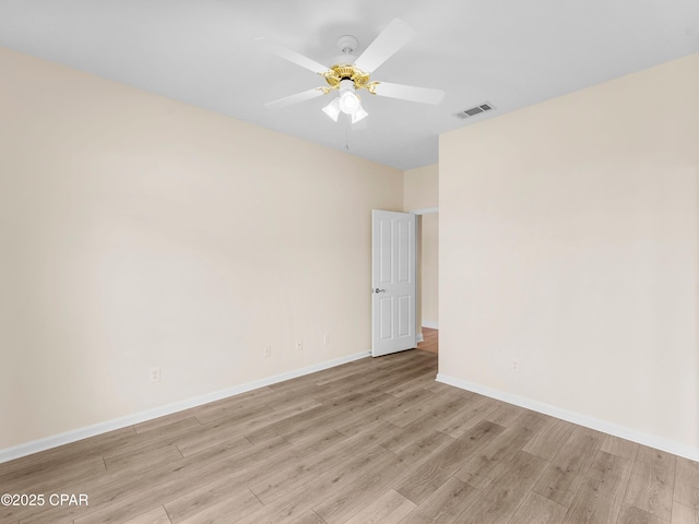 1406 New Jersey Ave, Lynn Haven, FL 32444 - spare room featuring light wood finished floors, baseboards, and ceiling fan