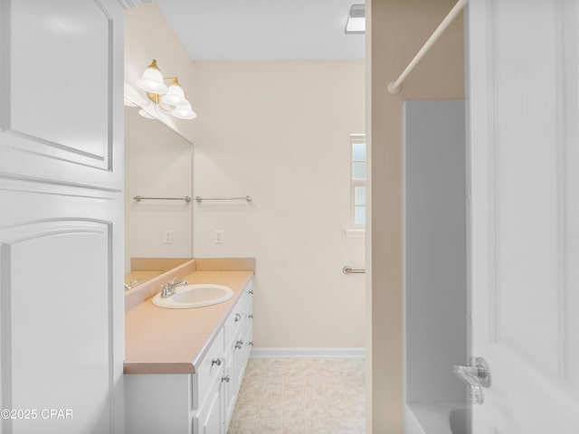 1406 New Jersey Ave, Lynn Haven, FL 32444 - bathroom with vanity, baseboards, shower / bathtub combination, and tile patterned floors
