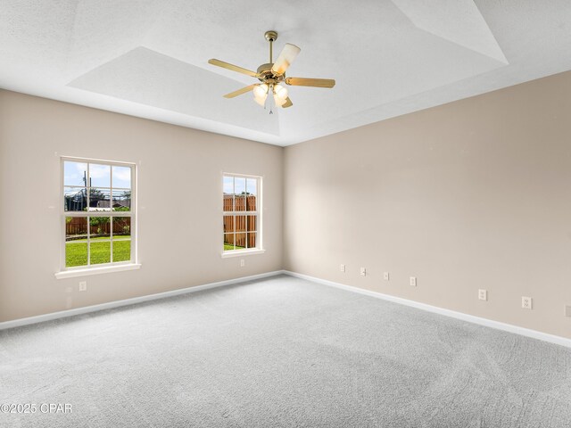 1406 New Jersey Ave, Lynn Haven, FL 32444 - carpeted spare room with healthy amount of natural light, baseboards, a ceiling fan, and a raised ceiling