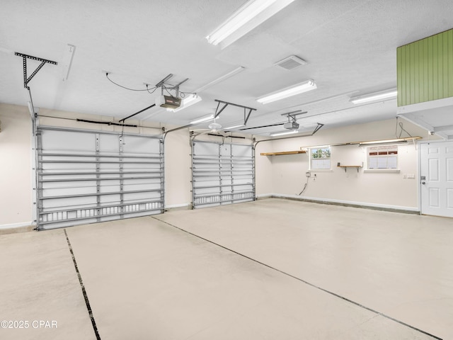 1406 New Jersey Ave, Lynn Haven, FL 32444 - garage with a garage door opener and baseboards