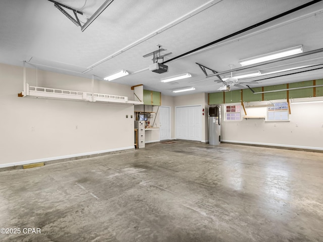 1406 New Jersey Ave, Lynn Haven, FL 32444 - garage featuring a garage door opener and baseboards