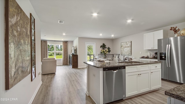 4132 Concord Blvd, Chipley, FL 32428 - kitchen with appliances with stainless steel finishes, a sink, light wood-type flooring, white cabinetry, and recessed lighting
