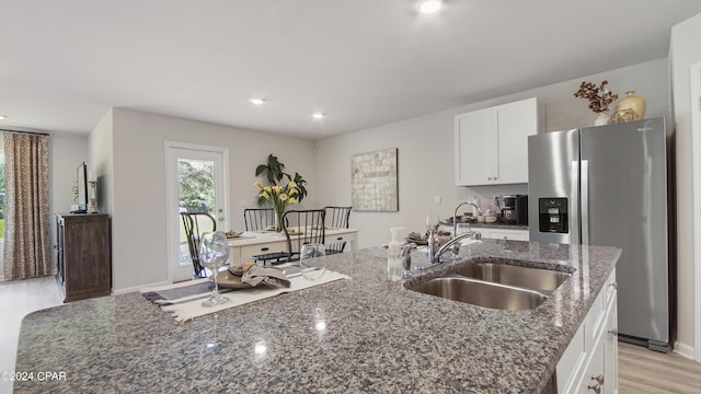 4132 Concord Blvd, Chipley, FL 32428 - kitchen with stainless steel refrigerator with ice dispenser, a sink, white cabinets, dark stone counters, and recessed lighting
