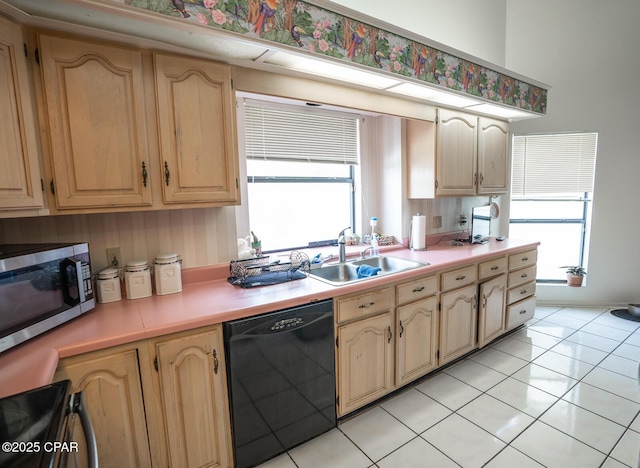 2712 Woodmere Dr, Panama City, FL 32405 - kitchen featuring dishwasher, stainless steel microwave, a sink, stove, and light countertops