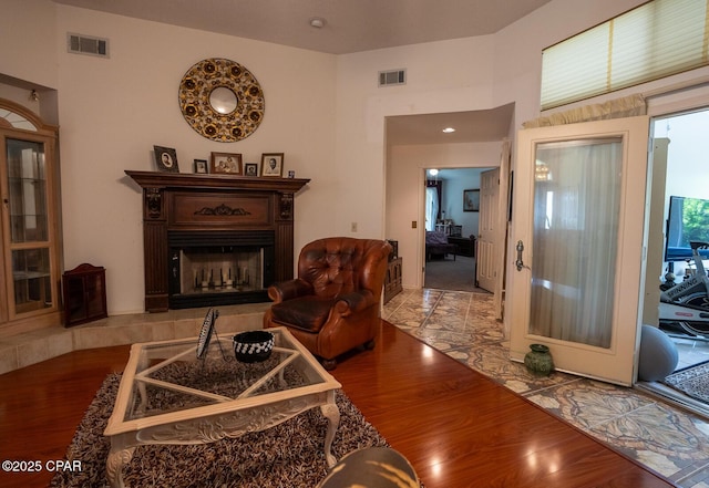 2712 Woodmere Dr, Panama City, FL 32405 - living area with wood finished floors and a fireplace with raised hearth