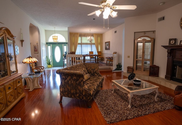 2712 Woodmere Dr, Panama City, FL 32405 - living room featuring arched walkways, wood finished floors, and a ceiling fan