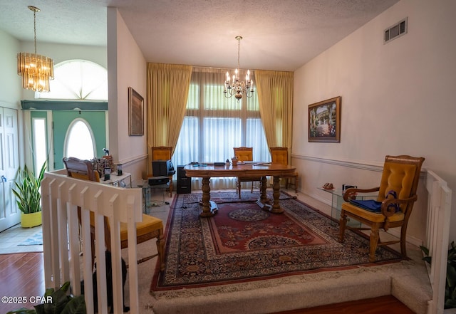 2712 Woodmere Dr, Panama City, FL 32405 - office featuring a chandelier, wood finished floors, and a textured ceiling