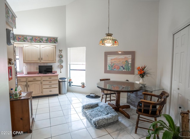 2712 Woodmere Dr, Panama City, FL 32405 - dining area with high vaulted ceiling and light tile patterned floors