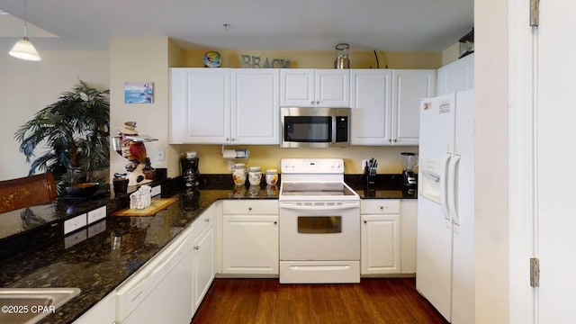 16819 Front Beach Rd Unit 903, Panama City Beach, FL 32413 - kitchen featuring white appliances, dark wood-style floors, white cabinets, hanging light fixtures, and dark stone counters