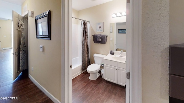 16819 Front Beach Rd Unit 903, Panama City Beach, FL 32413 - bathroom with wood finished floors, vanity, toilet, shower / bath combo, and baseboards