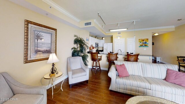 16819 Front Beach Rd Unit 903, Panama City Beach, FL 32413 - living room featuring rail lighting, crown molding, baseboards, dark wood-style flooring, and attic access