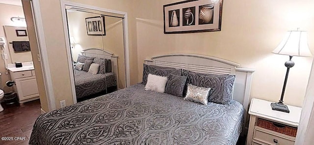 16819 Front Beach Rd Unit 903, Panama City Beach, FL 32413 - bedroom with dark wood-type flooring and a closet