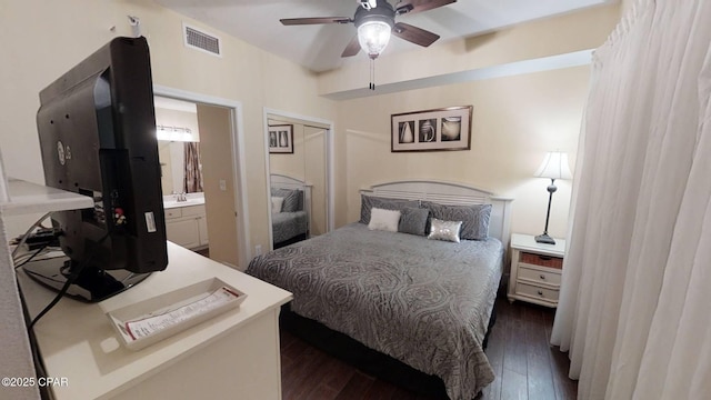 16819 Front Beach Rd Unit 903, Panama City Beach, FL 32413 - bedroom featuring dark wood-style flooring, a closet, ensuite bathroom, a ceiling fan, and a sink
