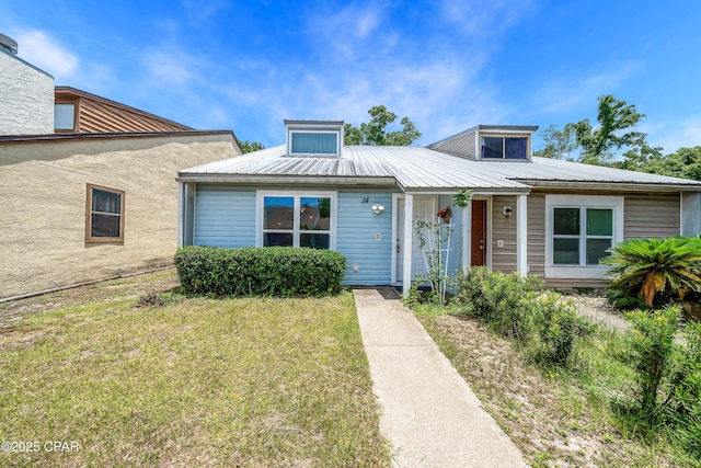 3415 W 19th St Unit 14, Panama City, FL 32405 - bungalow-style house featuring metal roof and a front lawn